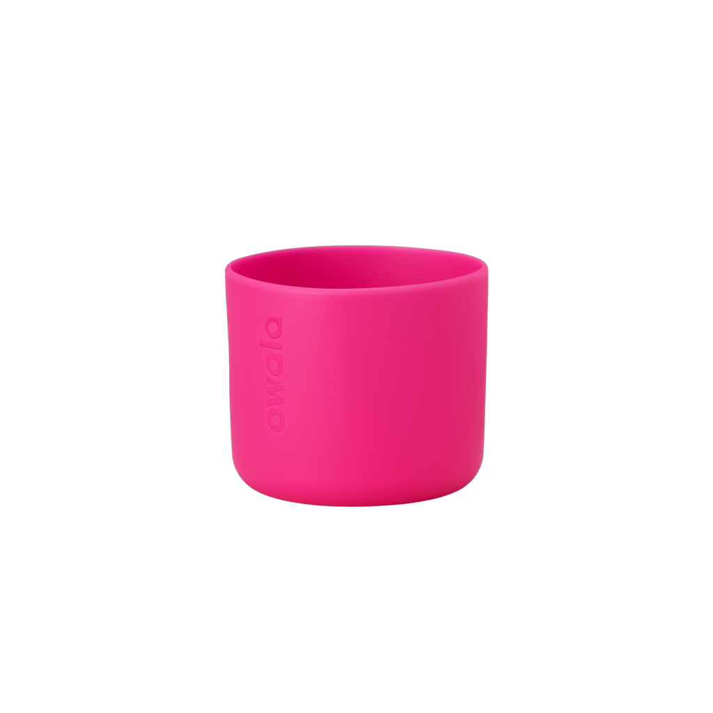 Owala Bottle Boot in vivid hot pink silicone with tonal Owala logo, short cylindrical form sized for 16oz Kids' FreeSip bottles