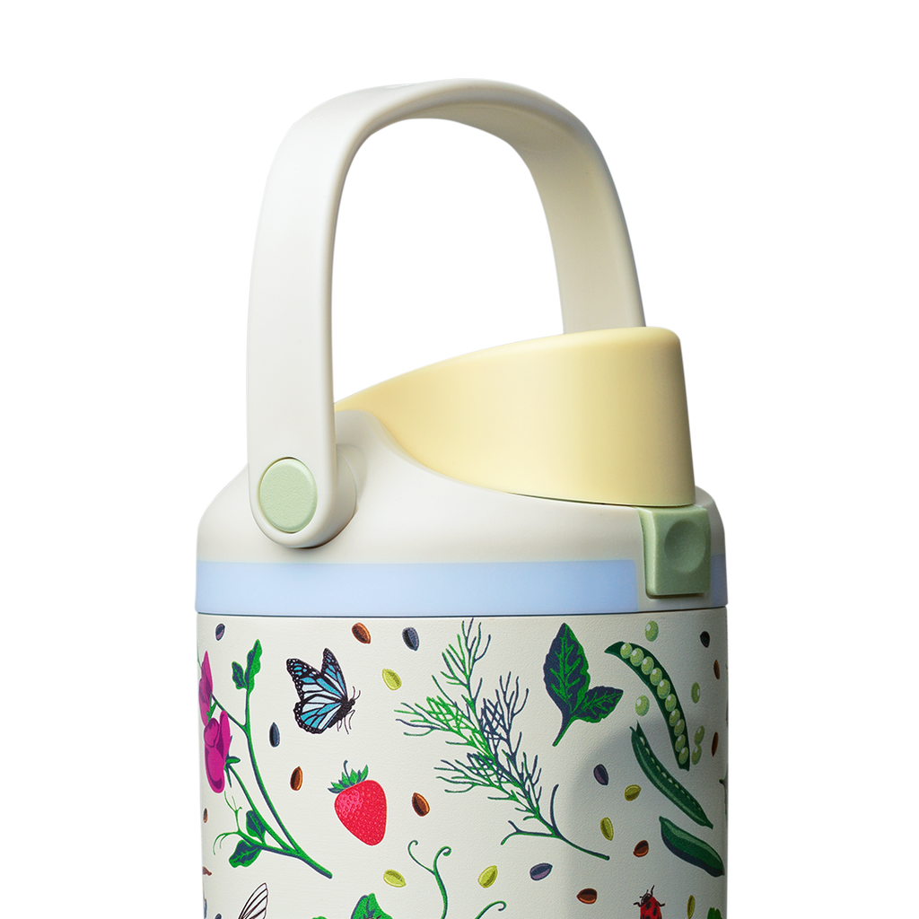 Owala FreeSip Sway 30oz, cream body with garden pattern, light blue lid with cream carry loop raised and yellow flip cap