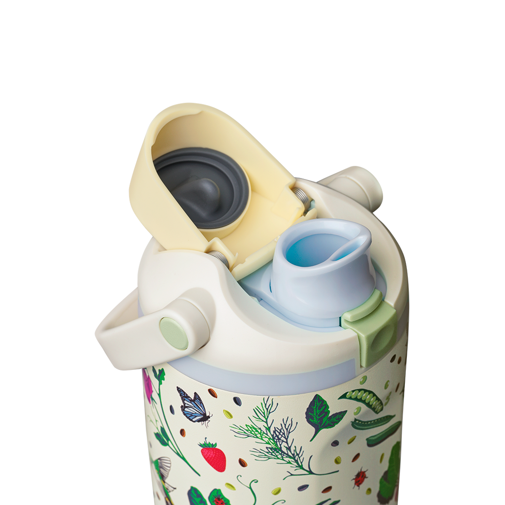 Owala FreeSip Sway 30oz, cream body with garden-themed pattern, butter yellow flip cap open exposing light blue FreeSip spout