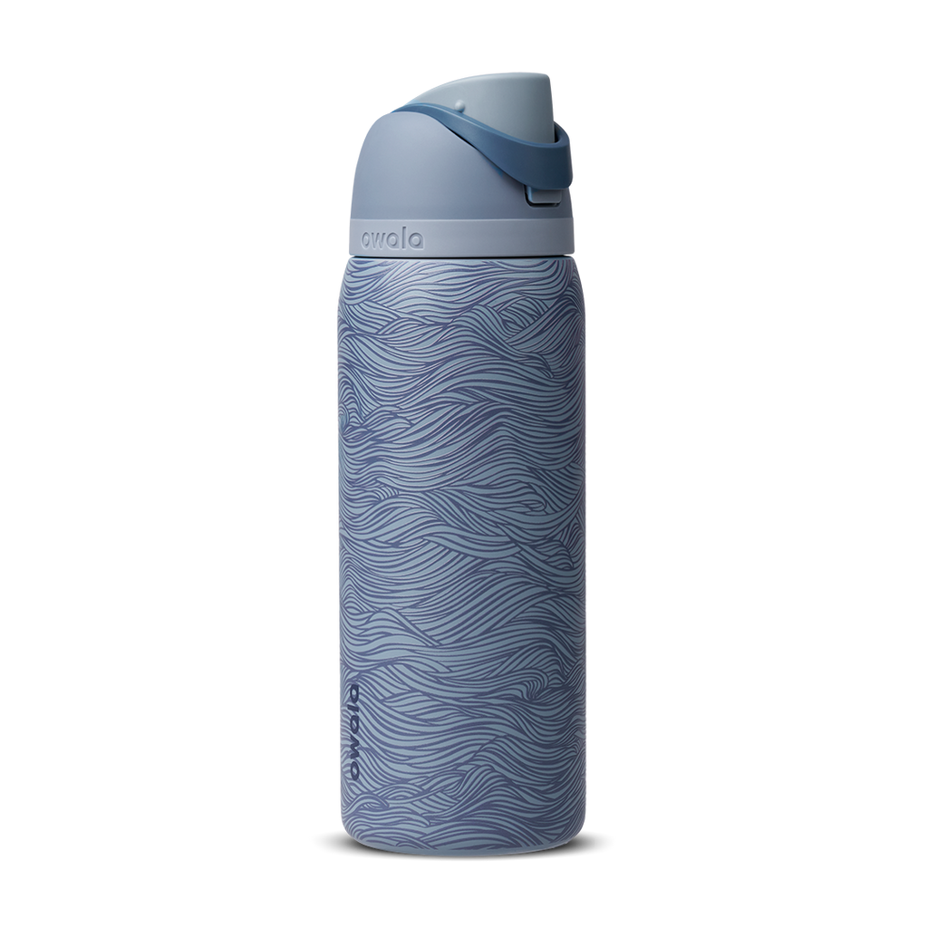 Owala FreeSip 32oz, slate blue body with embossed wave texture, lighter blue-gray lid, slate flip cap, and darker blue carry loop