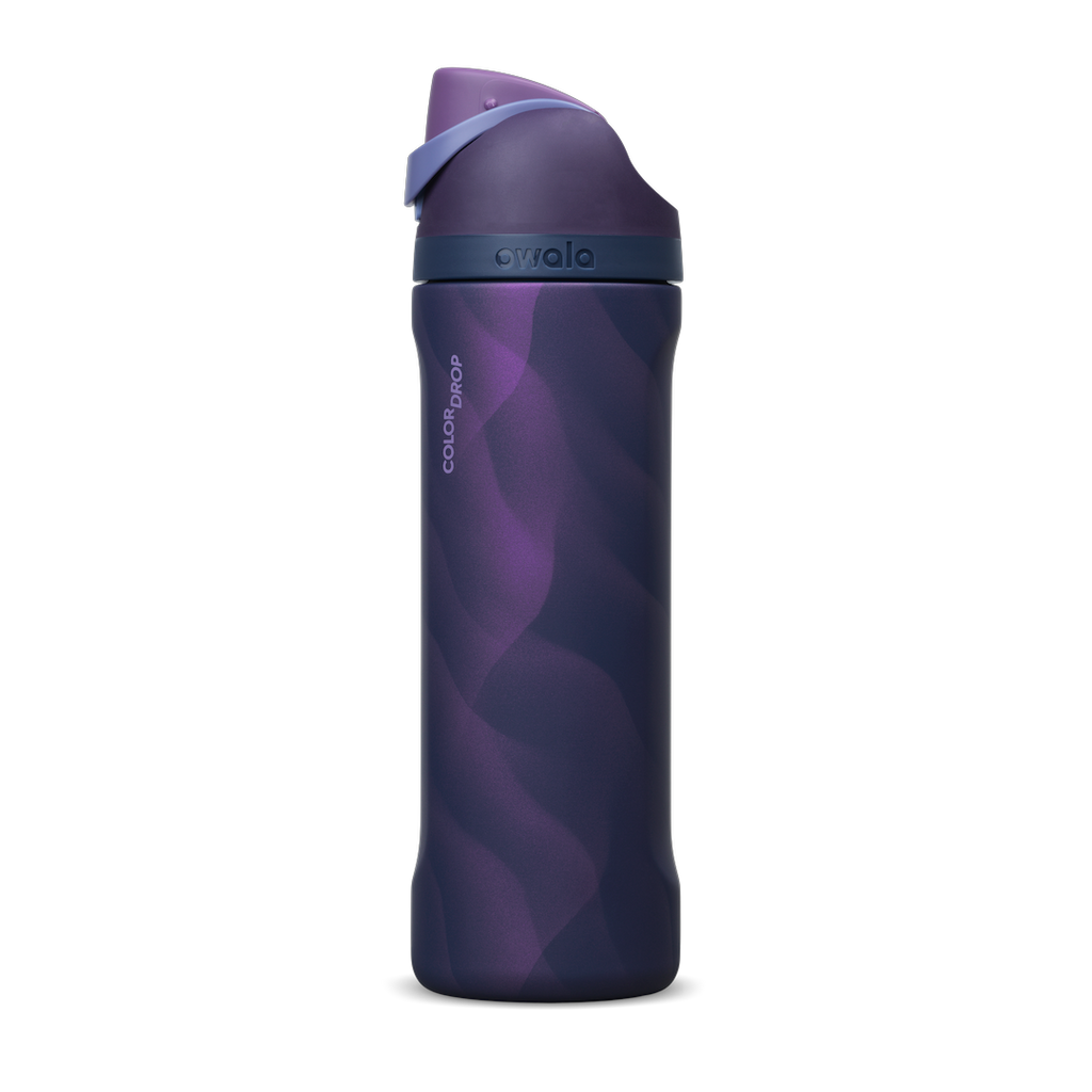 Owala FreeSip 24oz in Arctic Storm, deep purple insulated stainless steel bottle with wavy lavender pattern, navy lid with periwinkle carry loop and deep purple flip cap