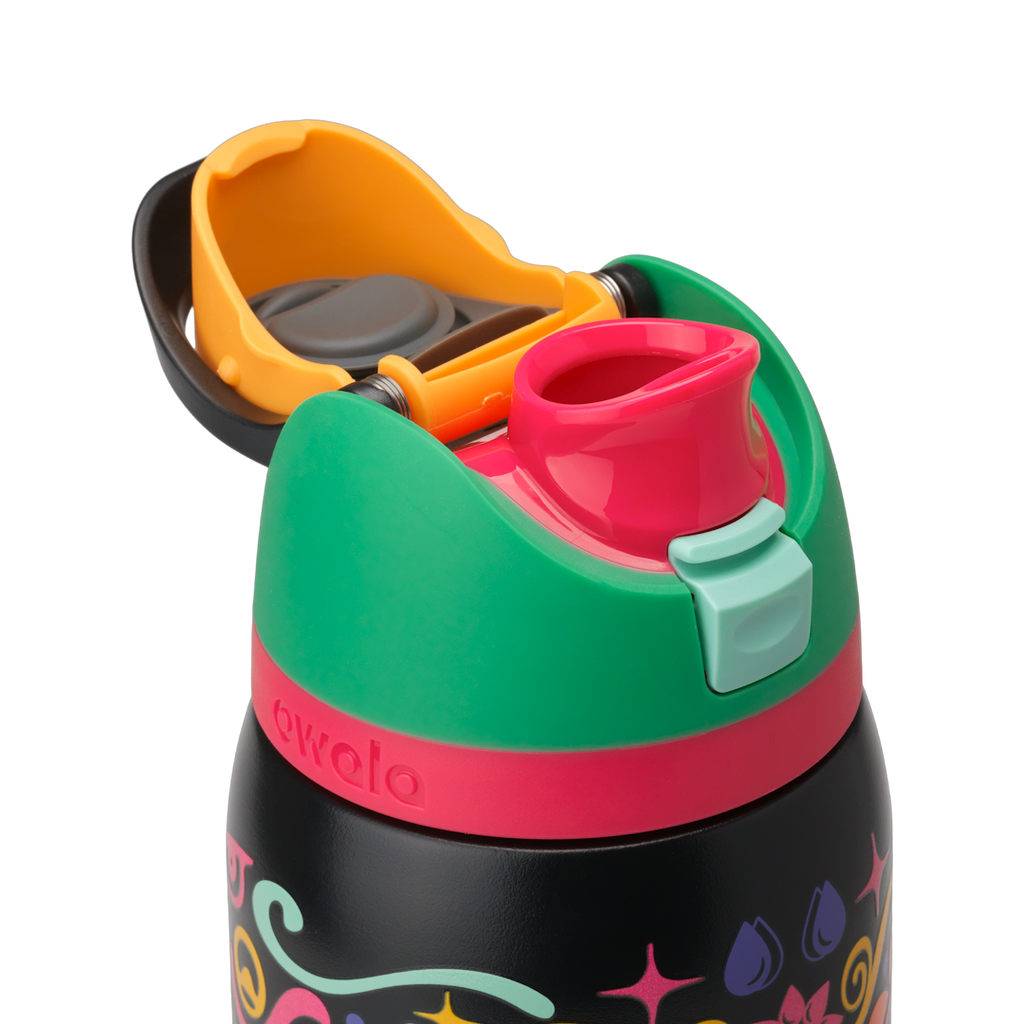 Owala FreeSip Sway 32oz in Sugar Skull, green flip cap open exposing pink FreeSip spout with mint green push-button over sugar-skull patterned body; glows in the dark