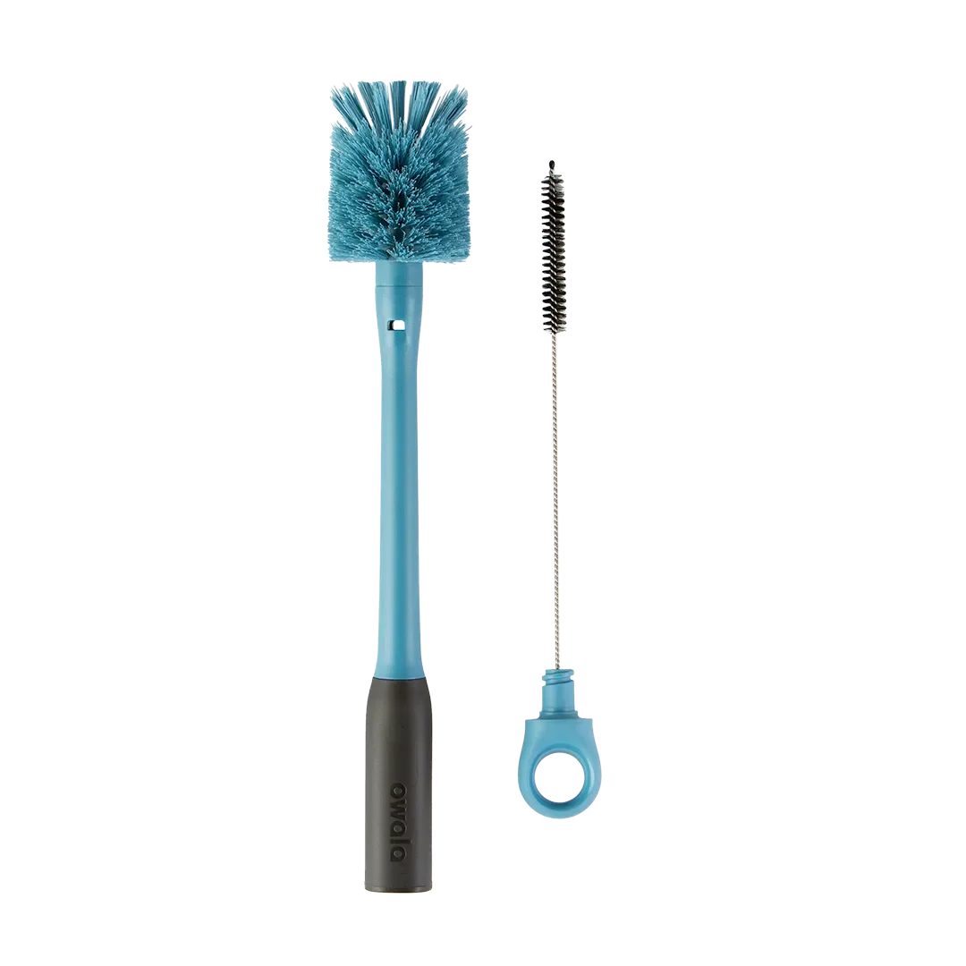 Owala 2-in-1 Bottle Brush in teal blue, large bristle brush with teal handle and dark gray grip beside small straw cleaner with teal ring handle
