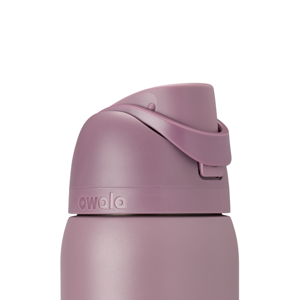 Owala FreeSip 32oz Spring Revival, lid closed detail showing dusty mauve flip cap with carry loop folded flat across the lid, accent band visible